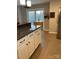 Kitchen with granite counters, white cabinetry, stainless appliances and direct access to an outdoor deck at 2049 Winding Oak Rd, Rock Hill, SC 29732