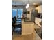 Kitchen featuring granite counters, bar seating, pendant lights and access to an outdoor deck at 2049 Winding Oak Rd, Rock Hill, SC 29732