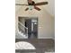 Bright open-concept living room showcasing vaulted ceilings, ceiling fan, carpet floors, and staircase at 2049 Winding Oak Rd, Rock Hill, SC 29732