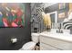 Stylish half-bathroom features custom paint, white vanity, and decor at 2130 Blewett Dr, Charlotte, NC 28269
