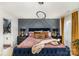 This bedroom features a textured wall design and modern light fixture above the bed at 2130 Blewett Dr, Charlotte, NC 28269
