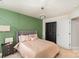 This bedroom features an accent wall, stylish decor, and a modern lighting fixture at 2130 Blewett Dr, Charlotte, NC 28269