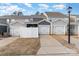 Home exterior with attached garages and an entrance to a private fenced in back patio at 2130 Blewett Dr, Charlotte, NC 28269