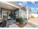 Charming home exterior featuring a covered patio, attached garage, and well-maintained landscaping at 2130 Blewett Dr, Charlotte, NC 28269