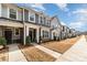 Attractive townhome with gray siding, well-maintained landscaping, sidewalk, and inviting front entry at 2130 Blewett Dr, Charlotte, NC 28269