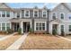 Charming townhome featuring gray siding, white trim, well-kept landscaping and a welcoming front entrance at 2130 Blewett Dr, Charlotte, NC 28269