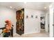 Hallway with neutral carpeting showcases art and a sun tunnel for natural light at 2130 Blewett Dr, Charlotte, NC 28269