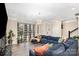 Spacious living room with a large sofa, contemporary lighting, and decorative windows at 2130 Blewett Dr, Charlotte, NC 28269