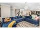 Open-concept living space with luxury vinyl flooring, neutral paint, and a large sectional at 2130 Blewett Dr, Charlotte, NC 28269