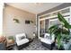 Inviting patio with stylish seating, patterned rug, and lush greenery, perfect for relaxation at 2130 Blewett Dr, Charlotte, NC 28269