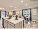 Open-concept living space showcases a modern kitchen island flowing into dining and a cozy living room at 2341 Trollinger Dr, Catawba, NC 28609