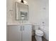 Bathroom featuring a white vanity with modern fixtures, a toilet, and a tiled shower/tub combination at 238 Laurel S Ave # B, Charlotte, NC 28207