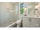 Modern bathroom featuring a glass-enclosed shower and a stylish vanity at 238 Laurel S Ave # B, Charlotte, NC 28207