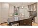 Bright modern kitchen with stainless steel appliances, a large island, and custom white cabinetry at 238 Laurel S Ave # B, Charlotte, NC 28207