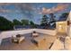 Enjoy the spacious rooftop deck with stylish furniture and stunning sky views at 238 Laurel S Ave # B, Charlotte, NC 28207
