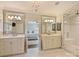 Spacious white bathroom with dual vanities, a glass-enclosed shower, and access to the bedroom at 2423 Lemon Tree Ln, Charlotte, NC 28211