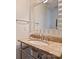 Elegant half bathroom features a marble countertop and decorative mirror at 2423 Lemon Tree Ln, Charlotte, NC 28211