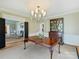 Elegant dining room with hardwood floors, chandelier, and seamless transition to living spaces at 2423 Lemon Tree Ln, Charlotte, NC 28211