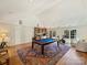 Spacious game room equipped with a billiards table, wet bar, and seating area at 2423 Lemon Tree Ln, Charlotte, NC 28211