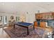 Entertainment area with a pool table, bar, and ample natural light at 2423 Lemon Tree Ln, Charlotte, NC 28211