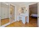 Hallway featuring a desk and doorways leading to the bathroom and bedroom at 2423 Lemon Tree Ln, Charlotte, NC 28211