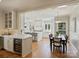 Open-concept kitchen featuring sleek cabinetry, center island, and seamless flow to the dining area at 2423 Lemon Tree Ln, Charlotte, NC 28211