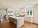 Well-appointed kitchen featuring a center island, custom cabinetry, and stainless steel appliances at 2423 Lemon Tree Ln, Charlotte, NC 28211