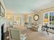 Bright living room featuring neutral tones, elegant furniture, and large windows for natural light at 2423 Lemon Tree Ln, Charlotte, NC 28211