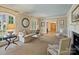 Inviting living room with neutral tones, fireplace, and ample natural light, perfect for relaxing or entertaining at 2423 Lemon Tree Ln, Charlotte, NC 28211