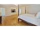 Comfortable bedroom with a four poster bed and a built in shelving unit at 2423 Lemon Tree Ln, Charlotte, NC 28211