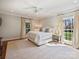 Bright main bedroom with large windows and neutral decor at 2423 Lemon Tree Ln, Charlotte, NC 28211