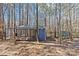 View of backyard chicken coop and run that are fenced in on the property at 2615 Farm House Ln, Monroe, NC 28110