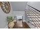 Hallway with hardwood floors, wrought iron staircase, and unique architectural details at 2615 Farm House Ln, Monroe, NC 28110