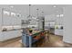 Modern kitchen with granite countertops, a large island, stainless steel appliances, and custom cabinetry at 2615 Farm House Ln, Monroe, NC 28110