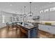 Spacious kitchen with marble countertops, an island with seating, and stainless steel appliances at 2615 Farm House Ln, Monroe, NC 28110