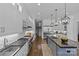 Bright modern kitchen with stainless appliances, breakfast bar, and hardwood floors at 2615 Farm House Ln, Monroe, NC 28110