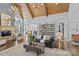 Elegant living room with a stone fireplace, exposed shelving, and an open archway at 2615 Farm House Ln, Monroe, NC 28110