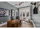 Home office with coffered ceilings, built-in shelving, and large windows for natural light at 2615 Farm House Ln, Monroe, NC 28110