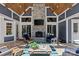 Relaxing outdoor patio features a stone fireplace, wood ceiling, and comfortable seating at 2615 Farm House Ln, Monroe, NC 28110