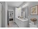 Bright bathroom featuring double vanity with white cabinets and decorative rug at 2721 Kilgo Way, Charlotte, NC 28205