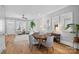 Spacious open concept with a large dining table and a peek into the main living space at 2721 Kilgo Way, Charlotte, NC 28205