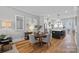 Open concept dining area with hardwood floors, designer lighting, and seamless flow to kitchen at 2721 Kilgo Way, Charlotte, NC 28205