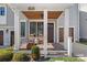 Inviting front porch with rocking chairs, wood ceiling, and stylish architectural design at 2721 Kilgo Way, Charlotte, NC 28205