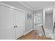 Upstairs hallway with hardwood floors, white trim, and neutral wall color at 2721 Kilgo Way, Charlotte, NC 28205