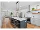 Bright, open kitchen featuring a large island with seating, stainless appliances, and modern finishes at 2721 Kilgo Way, Charlotte, NC 28205