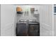 Laundry room with washer, dryer, and shelving unit at 2721 Kilgo Way, Charlotte, NC 28205