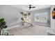 Bright home office featuring modern desk, ceiling fan, and large windows at 2721 Kilgo Way, Charlotte, NC 28205