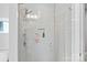 Modern walk-in shower featuring beautiful tile, sleek fixtures, and glass door at 2721 Kilgo Way, Charlotte, NC 28205