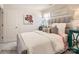 Comfortable bedroom showcasing a stylish bed with cushioned headboard, neutral bedding, and accent furniture at 2949 Legacy Ridge Ln, Catawba, NC 28609