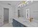 Modern bathroom featuring double sinks, stylish gold hardware, and neutral finishes at 315 Arlington Ave # 1206, Charlotte, NC 28203
